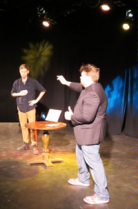 (Image: Johnathan on Stage with a Volunteer)