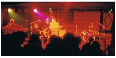 (Image: Levon Helm Sings at Center Mic with the Cate Brothers
  Band Behind)