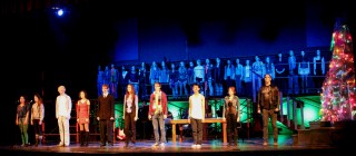 (Image: The Main Cast Downstage Sings `Seasons of Love' with the
  Chorus on Upstage Scaffolding)